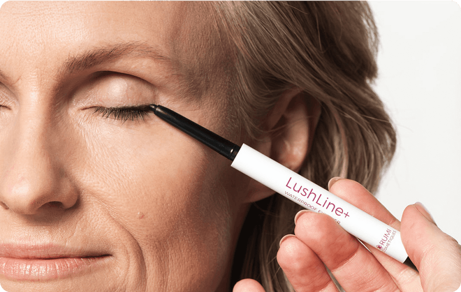 Woman applying LushLine+ Waterproof Eyeliner with her eyes closed